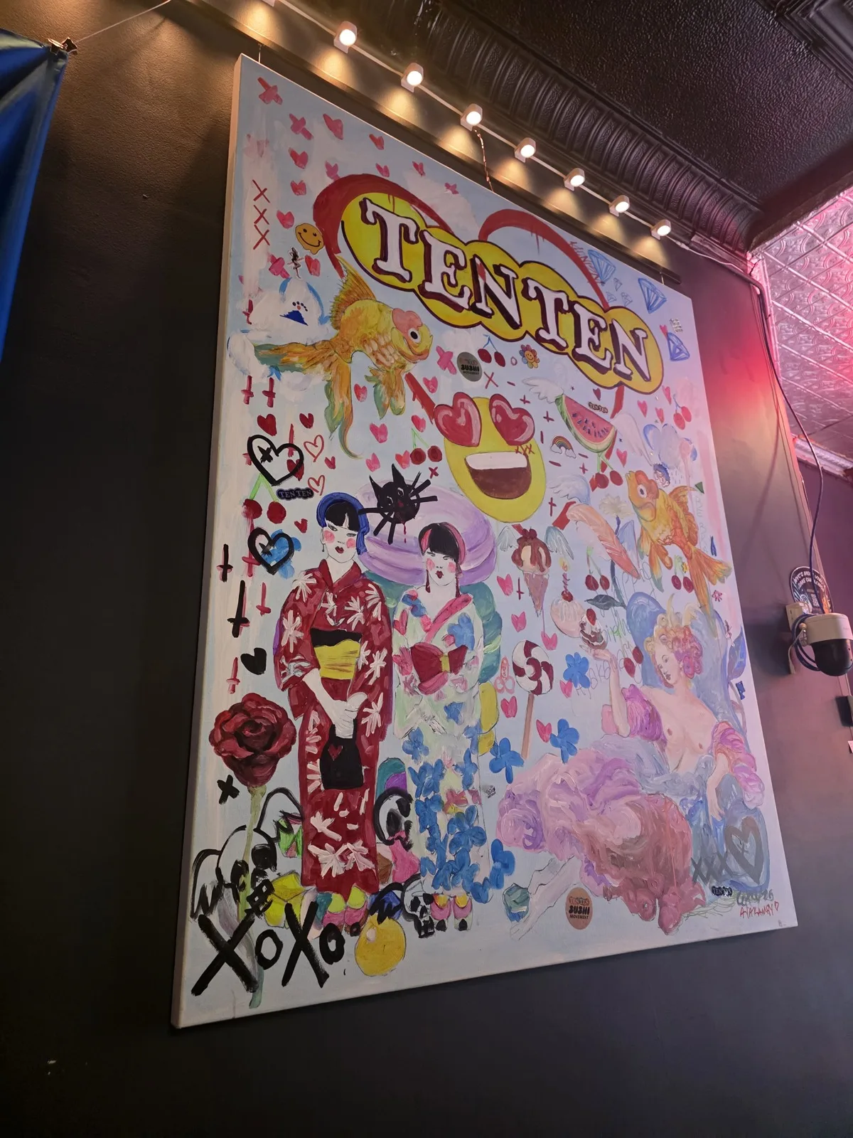 The TEN TEN mural hanging inside Izakaya Juraku